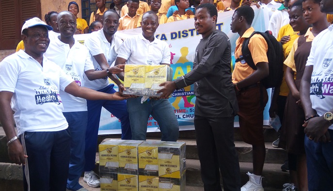 Rev Lawrence Ablorh (left) presenting books to Mr Alfred Asigbey Rev Lawrence Ablorh (left) presenting books to Mr Alfred Asigbey